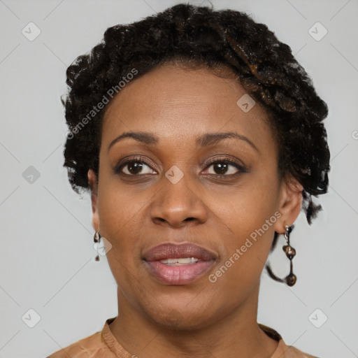 Joyful black adult female with short  brown hair and brown eyes