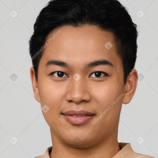 Joyful asian young-adult male with short  black hair and brown eyes