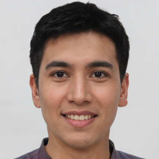 Joyful asian young-adult male with short  black hair and brown eyes