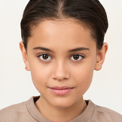 Joyful white child female with short  brown hair and brown eyes