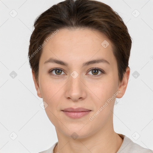 Joyful white young-adult female with short  brown hair and brown eyes