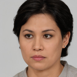 Neutral asian young-adult female with medium  brown hair and brown eyes