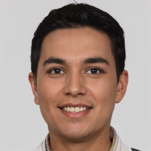 Joyful white young-adult male with short  black hair and brown eyes