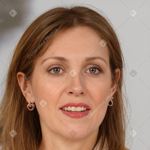 Joyful white adult female with long  brown hair and grey eyes