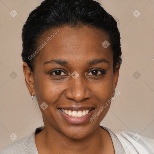 Joyful black young-adult female with short  black hair and brown eyes