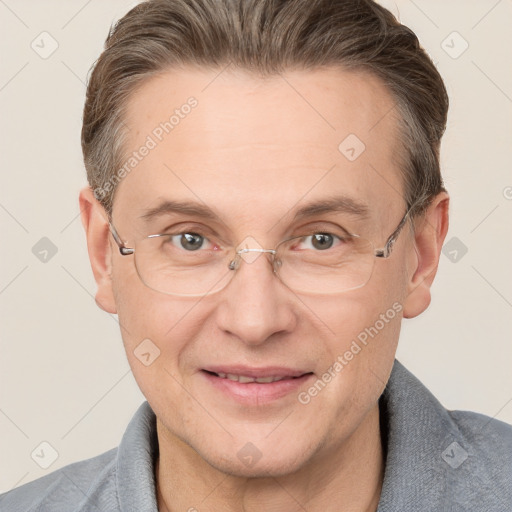 Joyful white adult male with short  brown hair and grey eyes