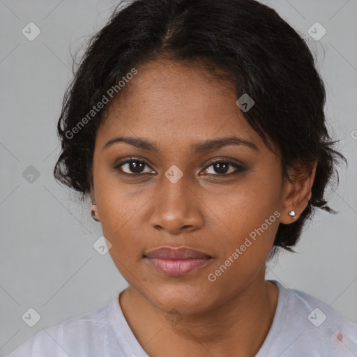 Joyful black young-adult female with medium  brown hair and brown eyes