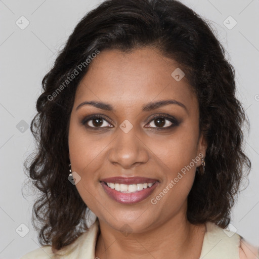 Joyful black young-adult female with long  brown hair and brown eyes