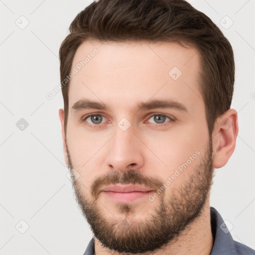 Neutral white young-adult male with short  brown hair and grey eyes