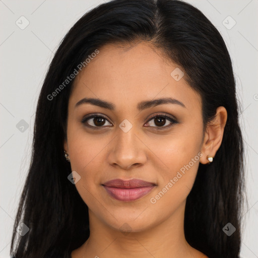 Joyful latino young-adult female with long  brown hair and brown eyes