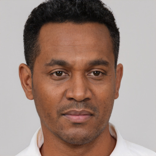 Neutral latino adult male with short  black hair and brown eyes