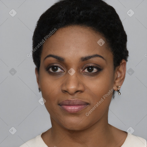 Joyful black young-adult female with short  black hair and brown eyes