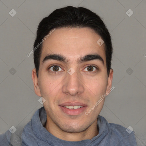 Joyful white young-adult male with short  black hair and brown eyes