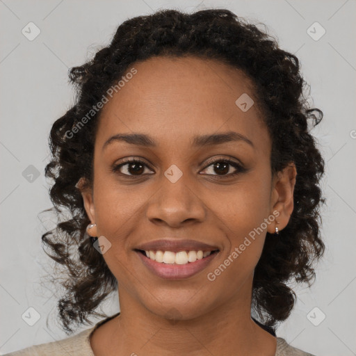 Joyful black young-adult female with medium  brown hair and brown eyes