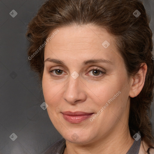 Joyful white adult female with long  brown hair and brown eyes