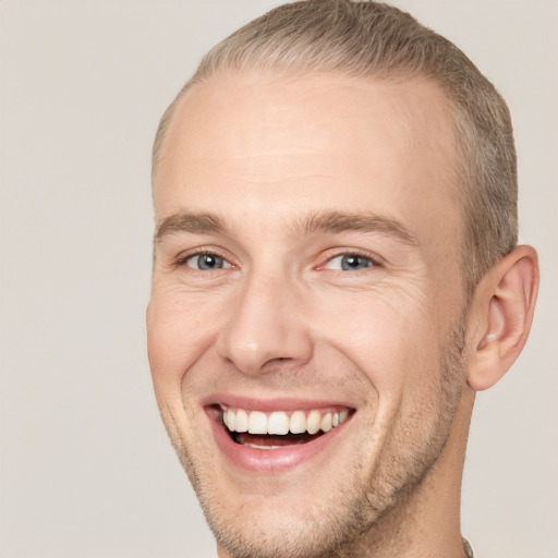 Joyful white adult male with short  brown hair and grey eyes