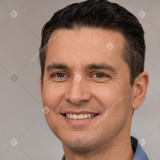 Joyful white adult male with short  brown hair and brown eyes