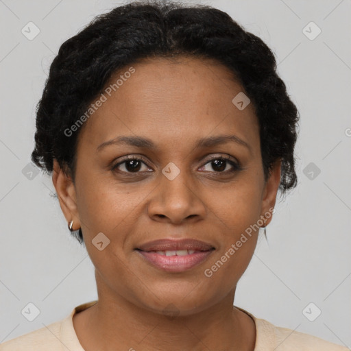 Joyful black adult female with short  brown hair and brown eyes