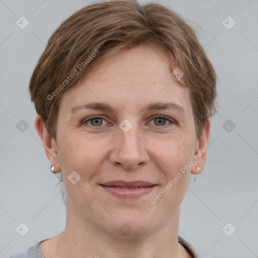 Joyful white adult female with short  brown hair and grey eyes