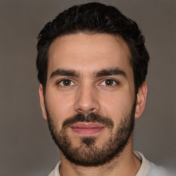 Neutral white young-adult male with short  black hair and brown eyes