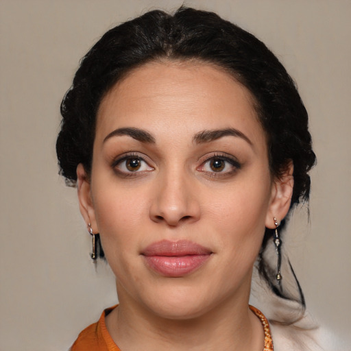 Joyful latino young-adult female with medium  black hair and brown eyes