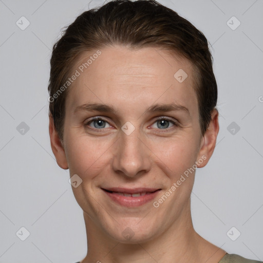 Joyful white young-adult female with short  brown hair and grey eyes