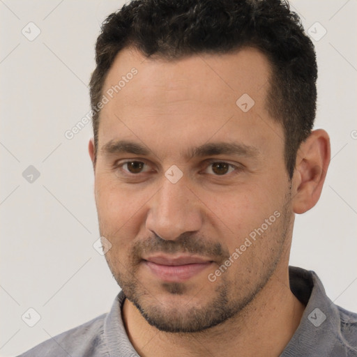 Joyful white young-adult male with short  brown hair and brown eyes