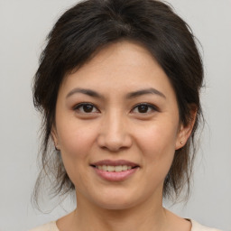 Joyful white young-adult female with medium  brown hair and brown eyes