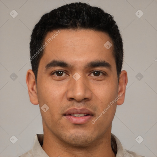 Joyful latino young-adult male with short  black hair and brown eyes