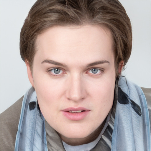 Joyful white young-adult female with medium  brown hair and blue eyes