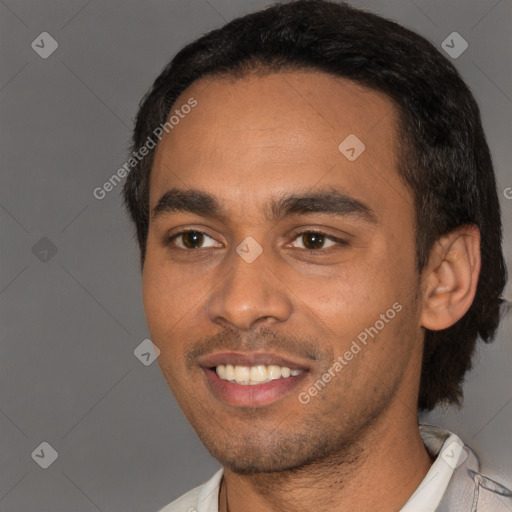 Joyful black young-adult male with short  black hair and brown eyes