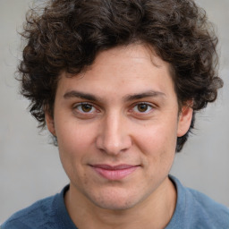 Joyful white young-adult male with medium  brown hair and brown eyes