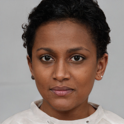 Neutral black young-adult female with short  brown hair and brown eyes
