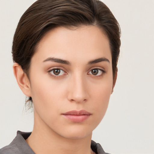 Neutral white young-adult female with short  brown hair and brown eyes