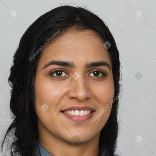 Joyful latino young-adult female with long  brown hair and brown eyes