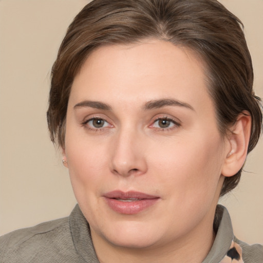 Joyful white young-adult female with medium  brown hair and brown eyes