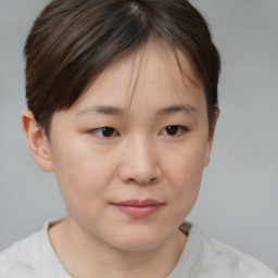 Joyful white child female with short  brown hair and brown eyes