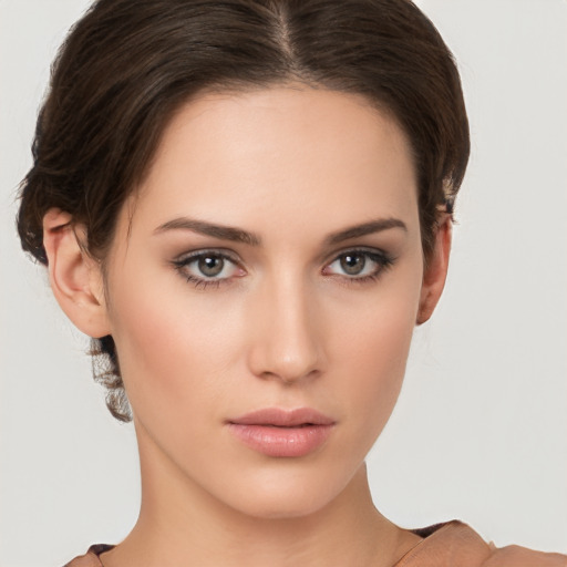 Neutral white young-adult female with short  brown hair and brown eyes