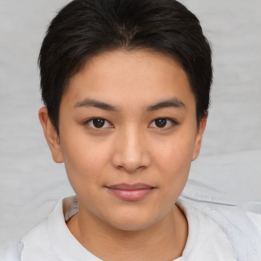 Joyful asian young-adult female with short  brown hair and brown eyes