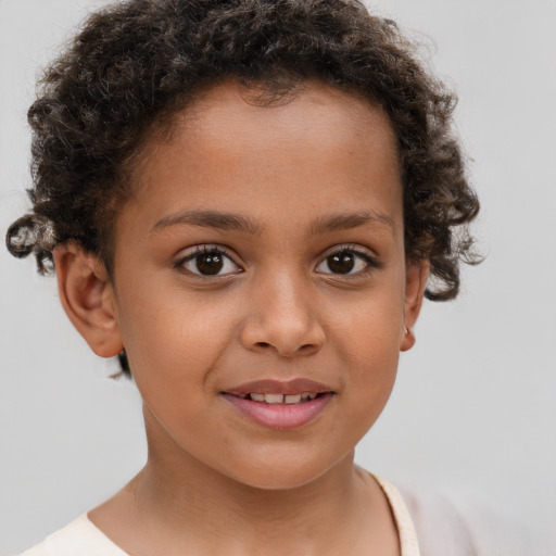 Joyful white child female with short  brown hair and brown eyes