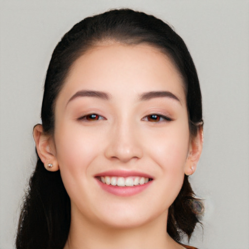 Joyful white young-adult female with long  black hair and brown eyes