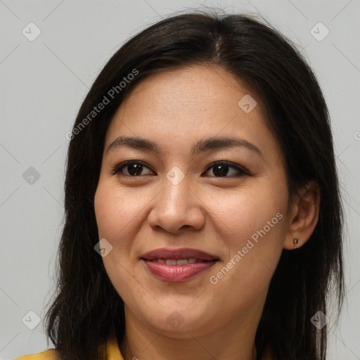 Joyful latino young-adult female with medium  brown hair and brown eyes