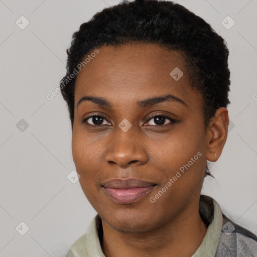 Joyful black young-adult female with short  black hair and brown eyes