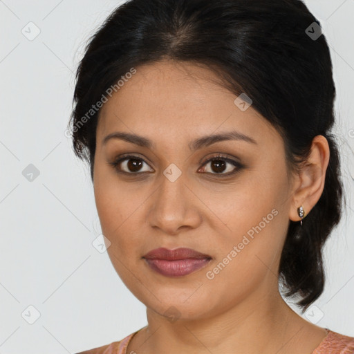 Joyful latino young-adult female with medium  brown hair and brown eyes