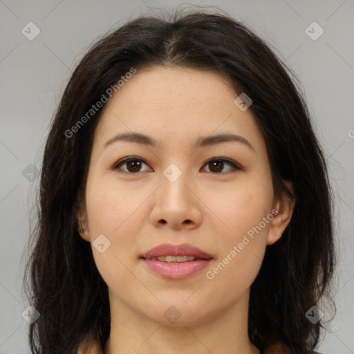 Joyful asian young-adult female with long  brown hair and brown eyes