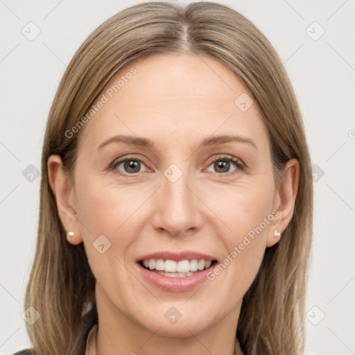 Joyful white adult female with long  brown hair and grey eyes