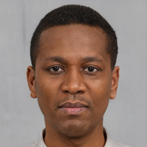 Neutral latino young-adult male with short  brown hair and brown eyes