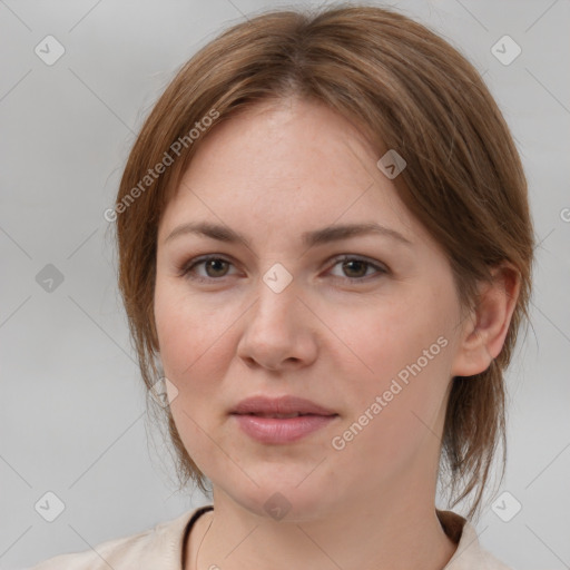 Joyful white young-adult female with medium  brown hair and grey eyes