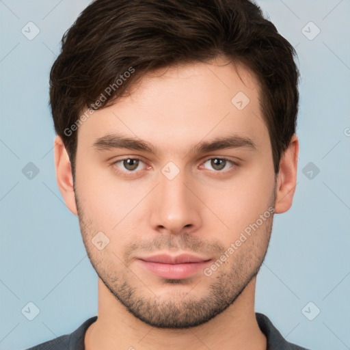 Neutral white young-adult male with short  brown hair and brown eyes