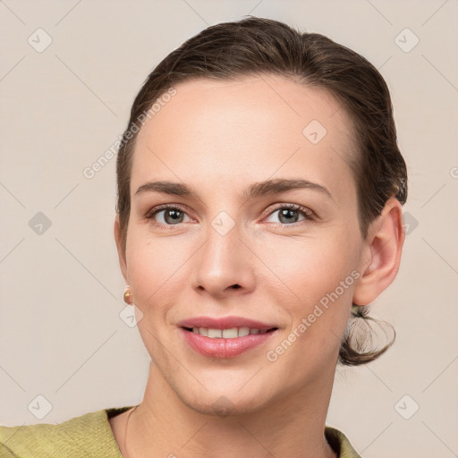 Joyful white young-adult female with short  brown hair and brown eyes